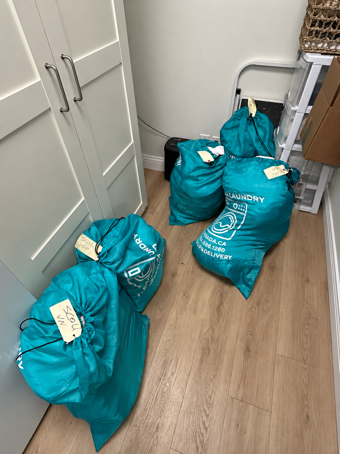 LABADA commercial laundry pickup bags at a Vancouver clinic