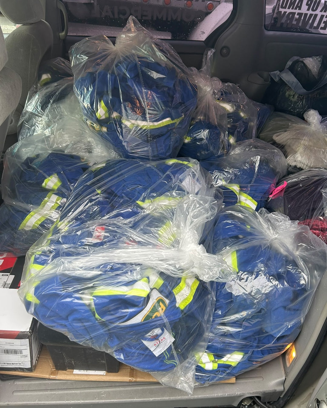 Commercial construction coveralls collected for LABADA workwear laundry pickup and delivery in British Columbia