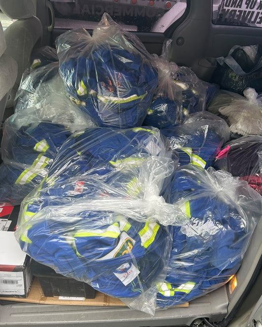 Commercial construction coveralls collected for LABADA workwear laundry pickup and delivery in British Columbia