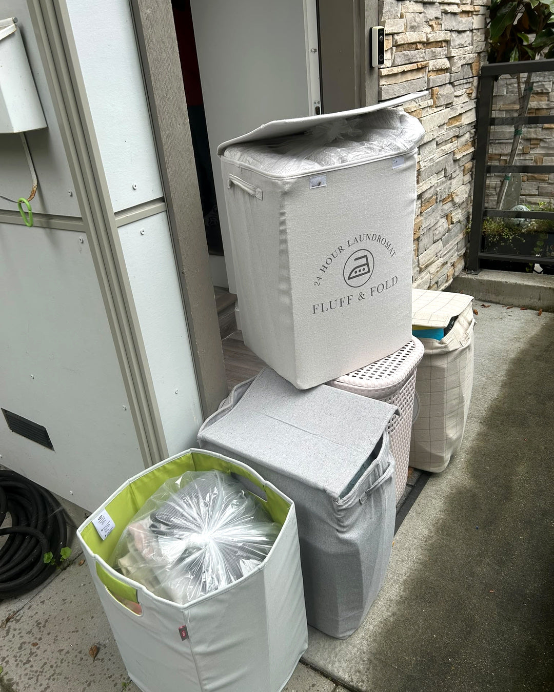 Household laundry baskets prepared for LABADA pickup and delivery service in North Vancouver, British Columbia