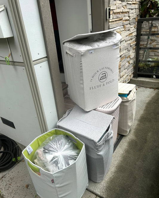 Household laundry baskets prepared for LABADA pickup and delivery service in North Vancouver, British Columbia