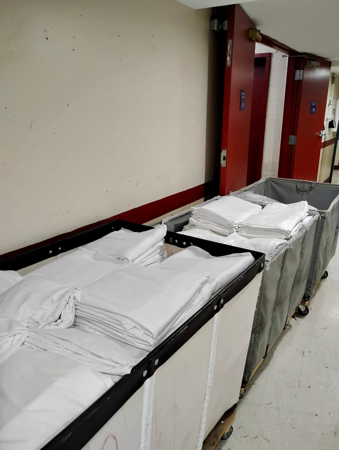 Clean folded hotel linens ready for housekeeping after commercial laundry processing in Vancouver